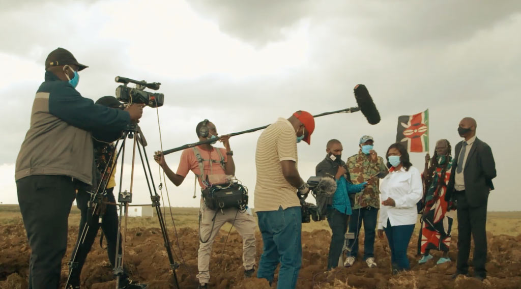 Wanjugu and film crew interviewing, Our Land Our Freedom documentary